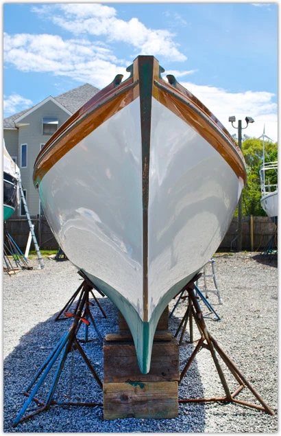 Front view of a painted boat topside in white