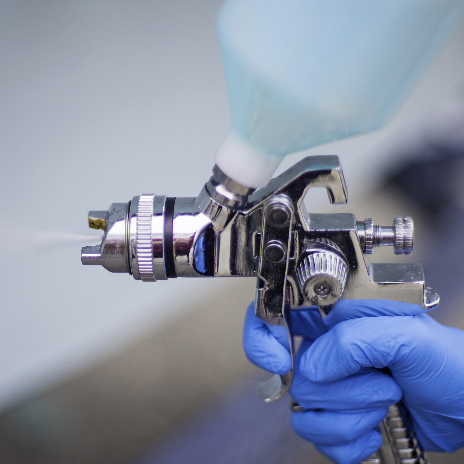Up close of paint spray gun tip