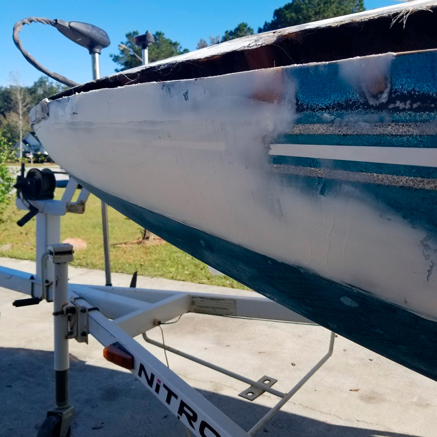 TotalBoat polyester fairing compound applied over boat hull