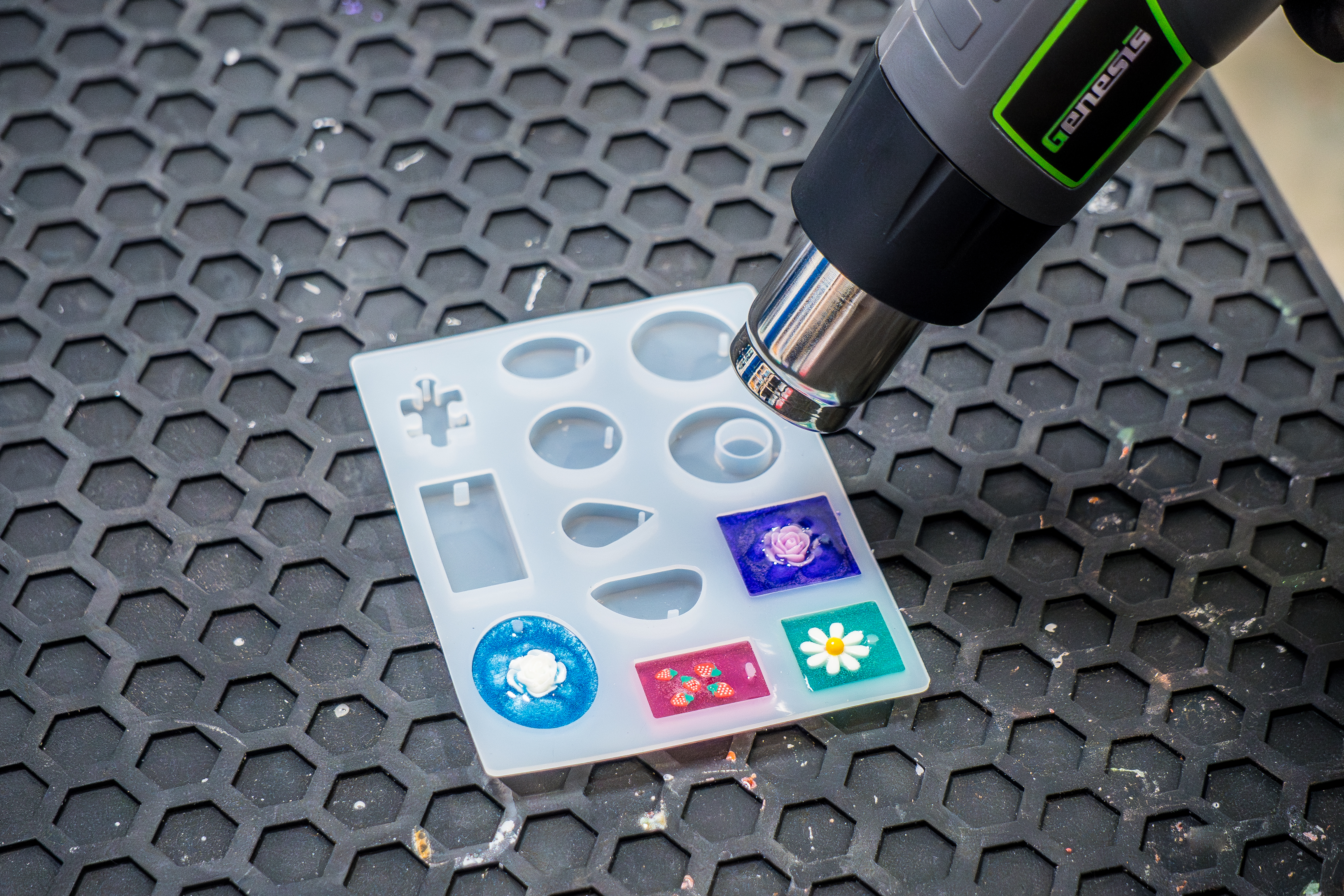 Using a heat gun to pop bubbles in epoxy resin mold