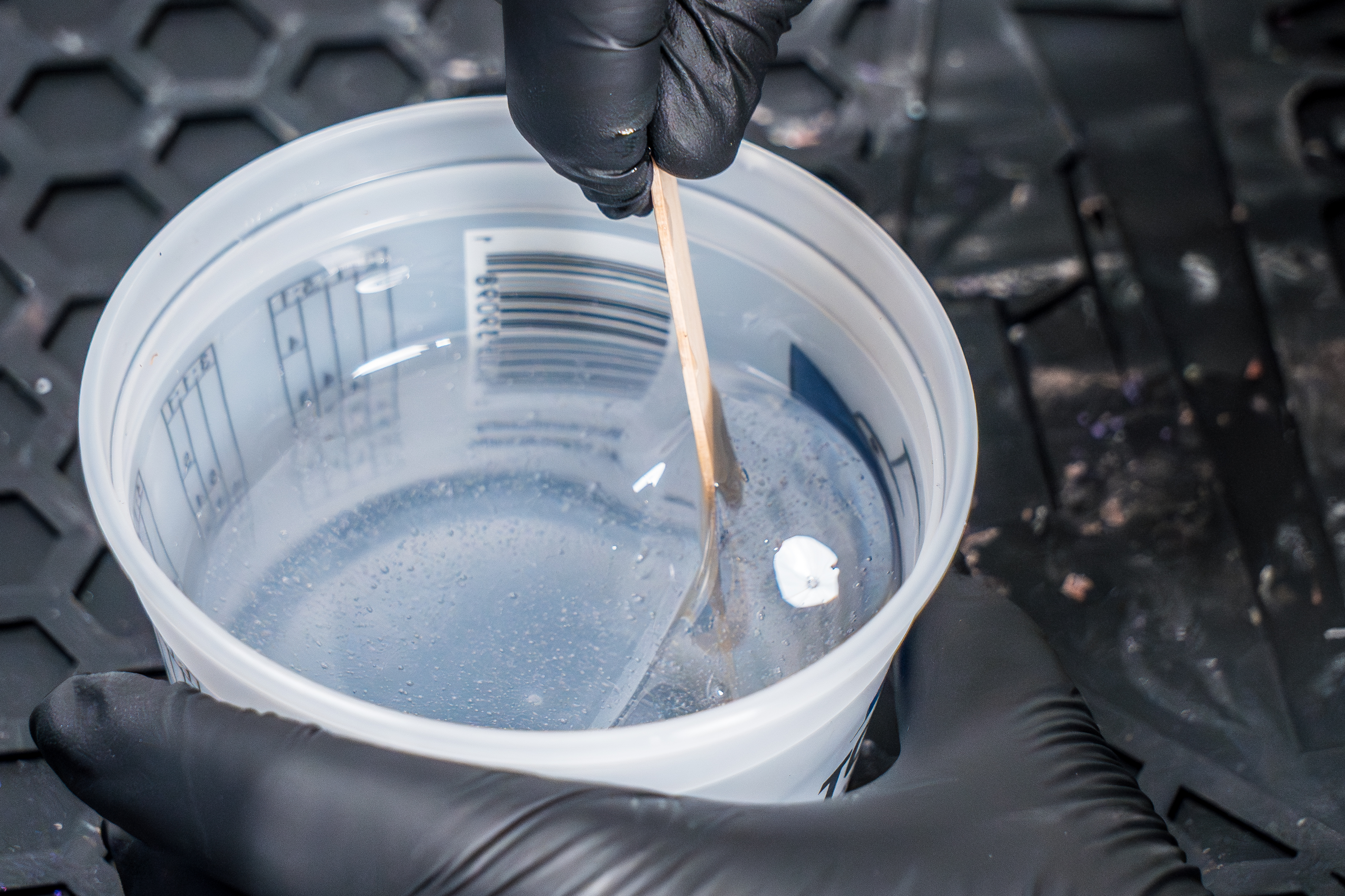 Close Up of TotalBoat Artist Resin Being Mixed with Wood Stir Stick