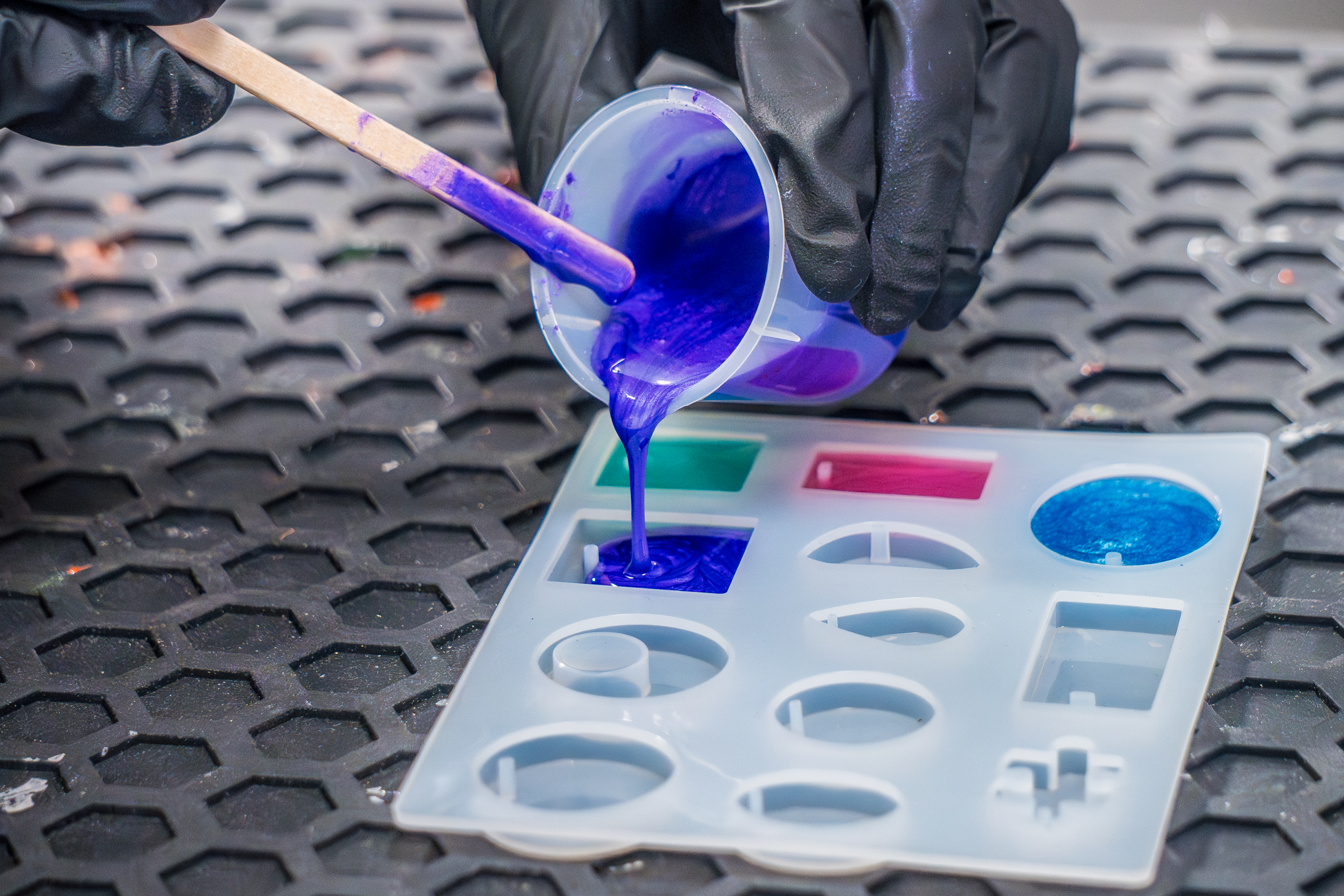 Pouring Purple Epoxy Resin into Jewelry Mold
