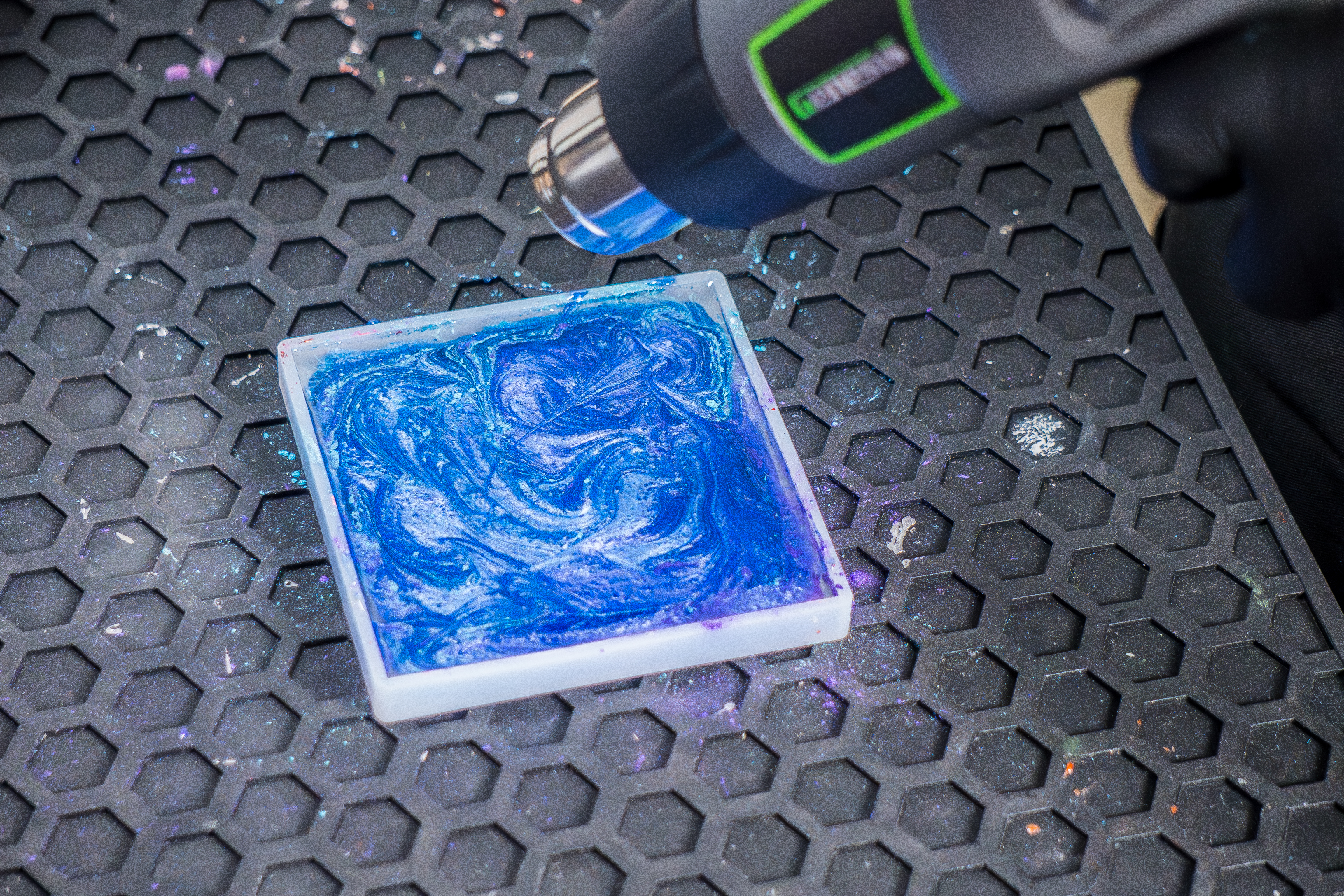 Heat gun popping bubbles in epoxy resin coaster mold